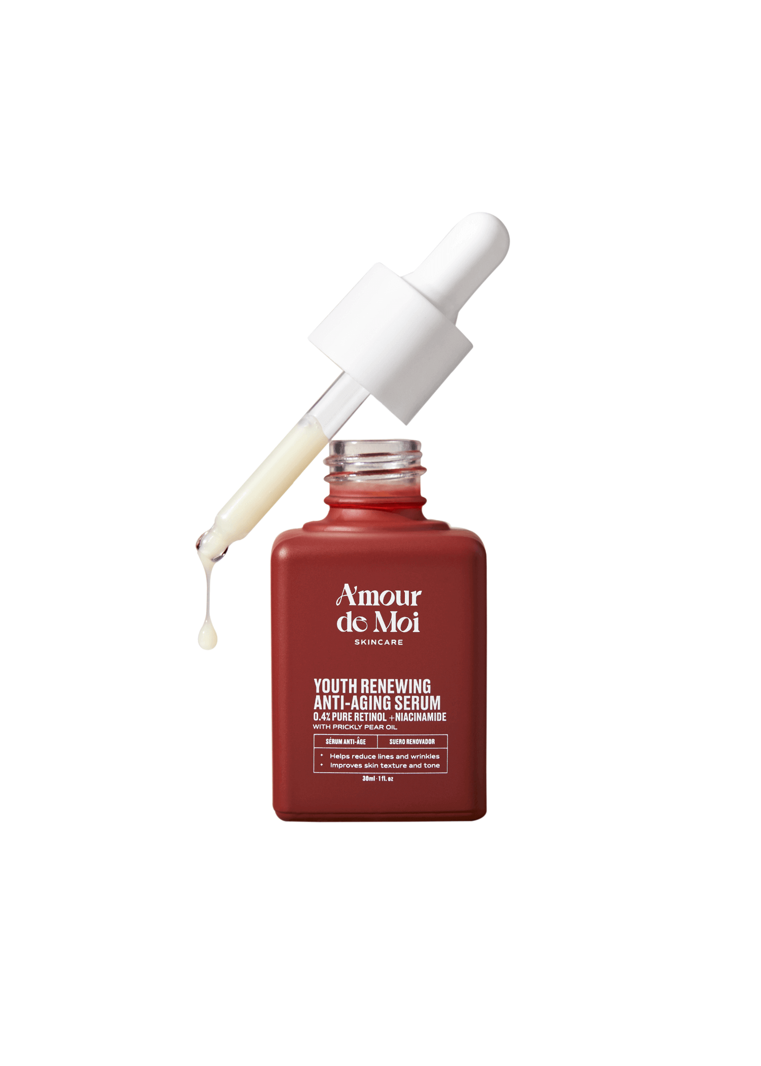 An open bottle of youth renewing anti-aging serum with dropper dripping product on white background