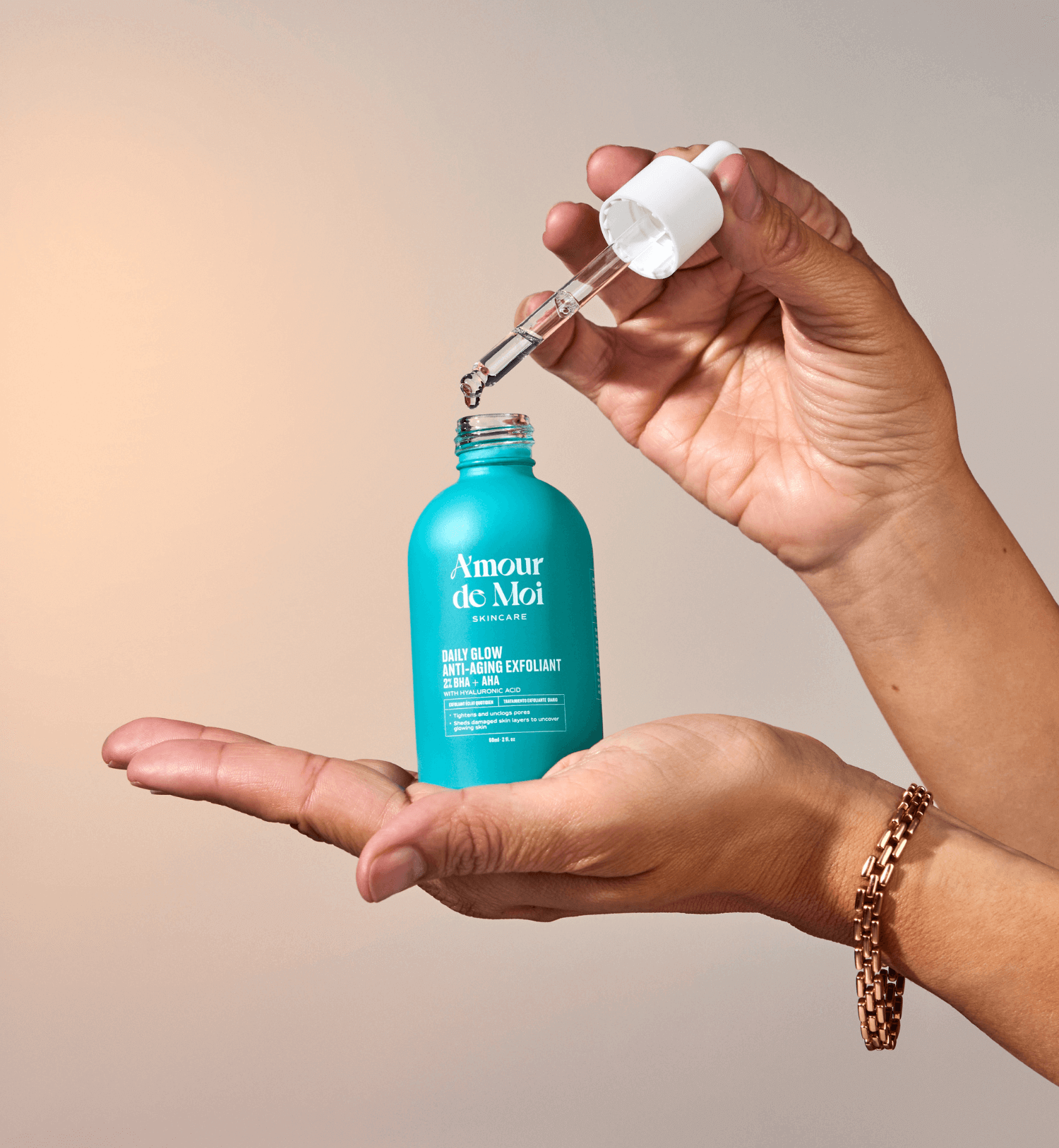 Woman holding and opening a bottle of BHA AHA daily glow anti-aging exfoliant showcasing product