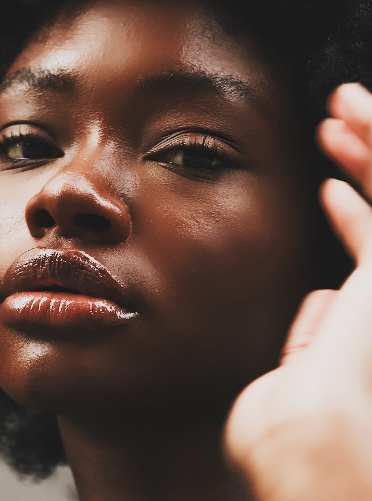 Close up of dark Skinned Woman Looking At Camera with great skin